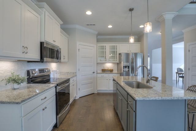 kitchen with dark hardwood / wood-style flooring, sink, tasteful backsplash, and stainless steel appliances