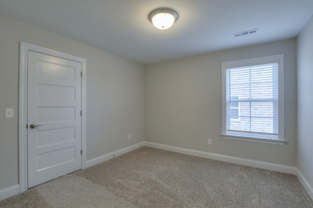 empty room with light colored carpet