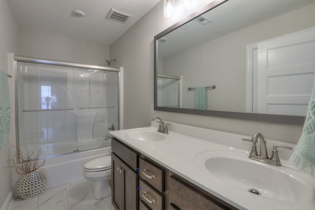 full bathroom with toilet, combined bath / shower with glass door, tile flooring, and dual bowl vanity