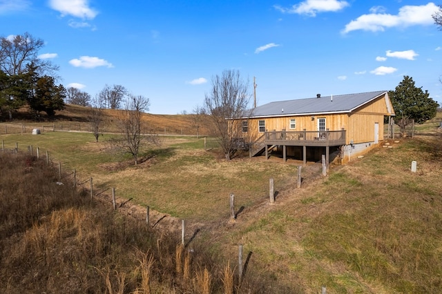 view of yard featuring a deck and a rural view