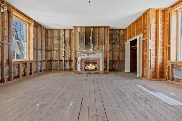 unfurnished living room with light hardwood / wood-style flooring and a fireplace