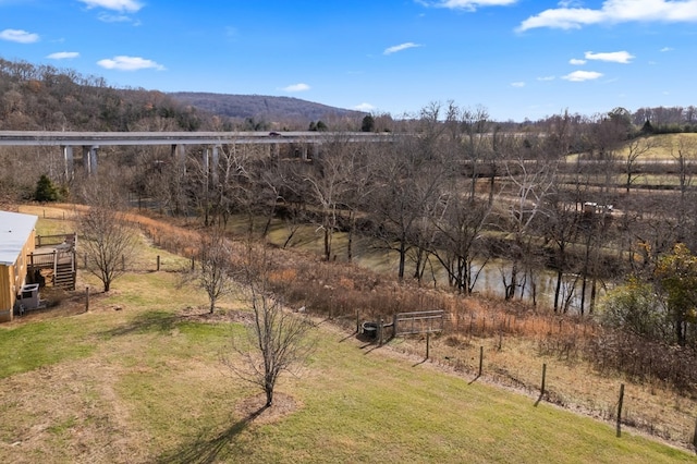 view of yard with a rural view