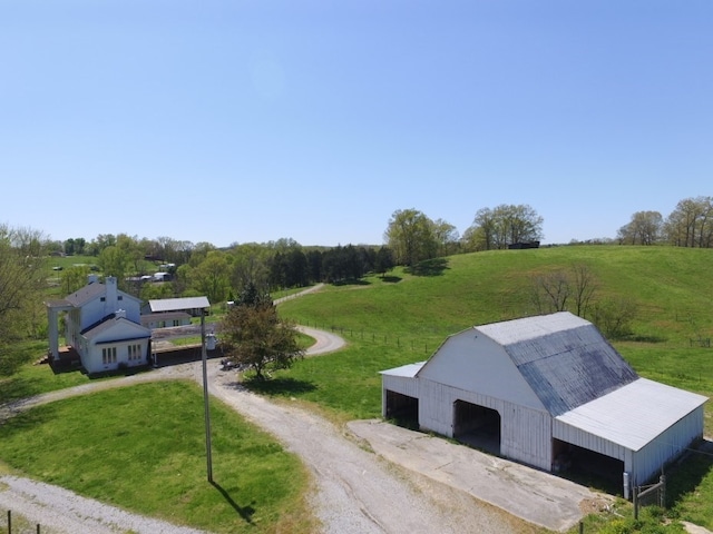 birds eye view of property featuring a rural view