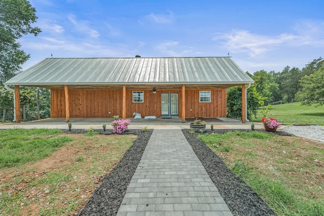 view of front facade with covered porch and a front lawn