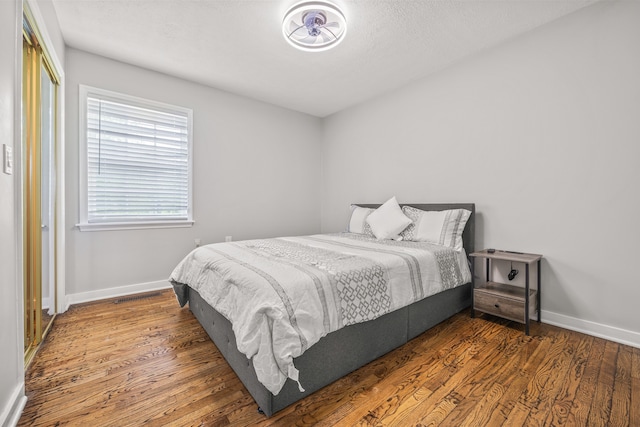 bedroom featuring dark hardwood / wood-style floors