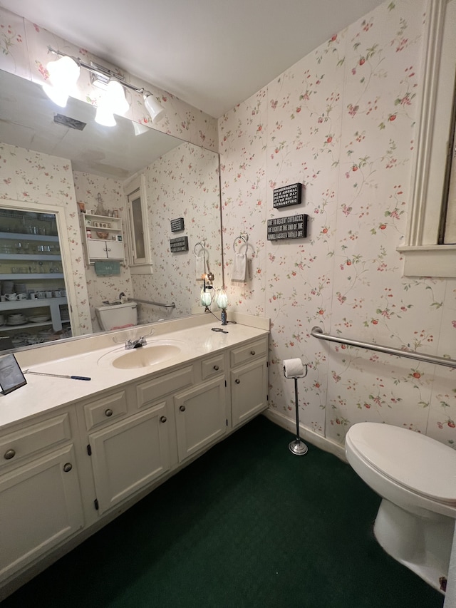 bathroom with vanity and toilet