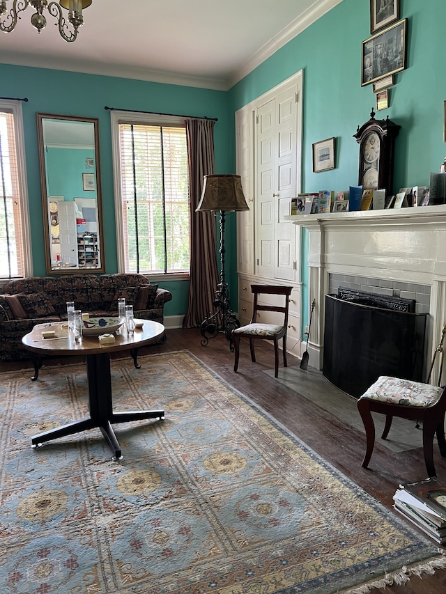 living room featuring ornamental molding and hardwood / wood-style floors