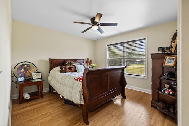 bedroom featuring ceiling fan and light hardwood / wood-style flooring