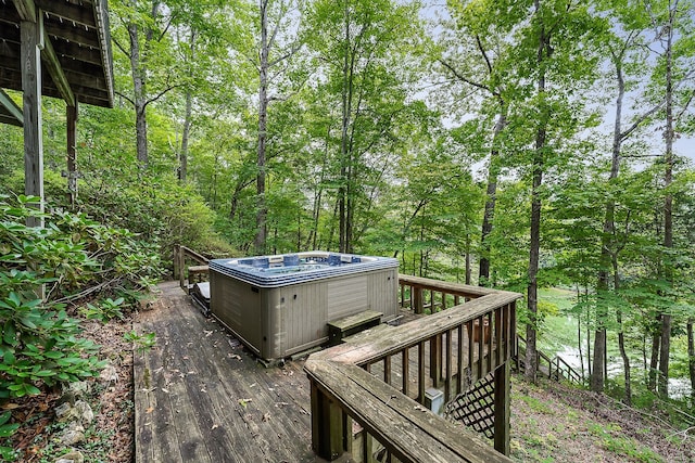 wooden deck with a hot tub