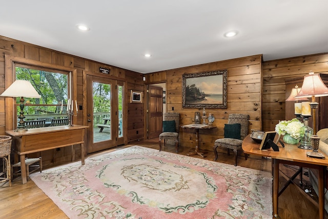 interior space featuring wooden walls and light wood-type flooring