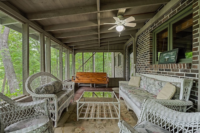 sunroom featuring ceiling fan, plenty of natural light, vaulted ceiling, and wooden ceiling