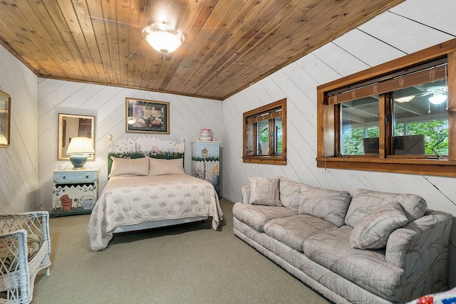 carpeted bedroom with wood walls, vaulted ceiling, wooden ceiling, and multiple windows