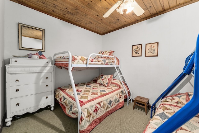 carpeted bedroom with wooden ceiling and ceiling fan