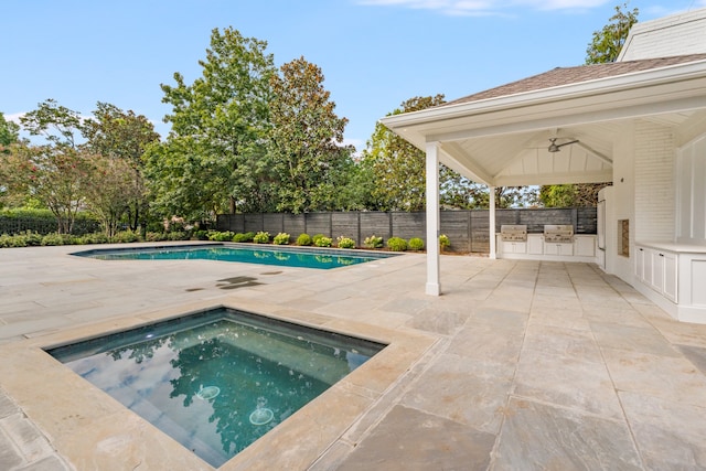 view of pool featuring an in ground hot tub, area for grilling, ceiling fan, and a patio