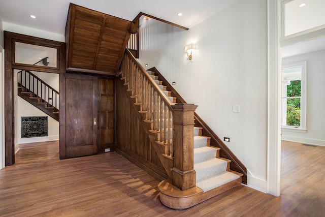 stairs with dark wood-type flooring