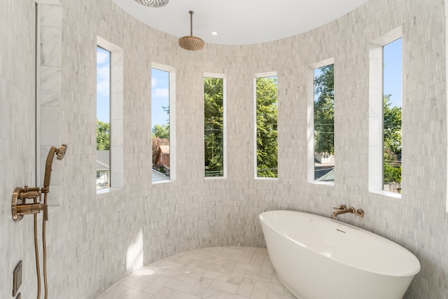 bathroom featuring tile flooring and tile walls