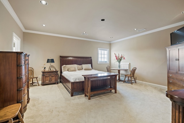 bedroom with ornamental molding and light colored carpet