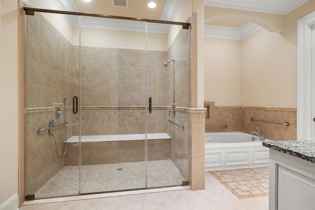 bathroom featuring shower with separate bathtub, vanity, ornamental molding, and tile floors