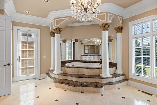 bathroom featuring an inviting chandelier, tile floors, tiled bath, ornamental molding, and ornate columns