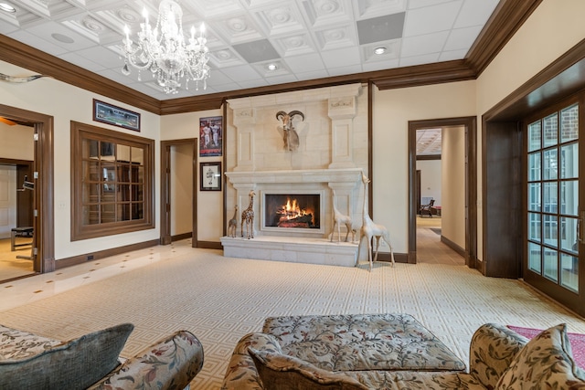 living room featuring a notable chandelier, coffered ceiling, and ornamental molding