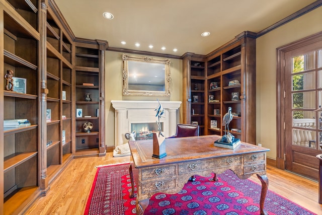 office featuring ornamental molding and light hardwood / wood-style flooring