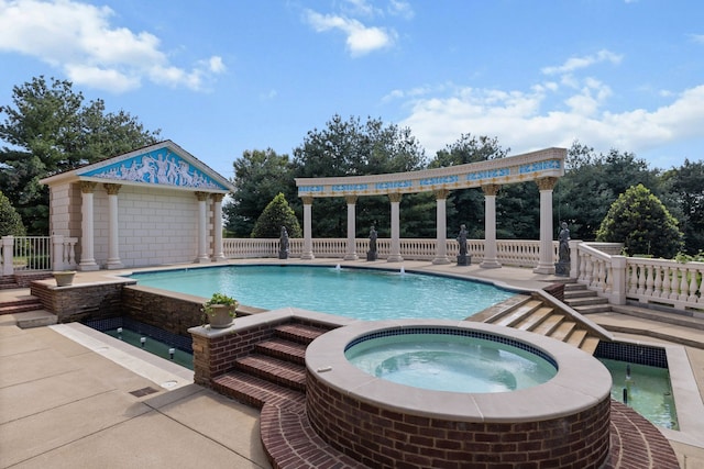 view of pool featuring an in ground hot tub and a patio area