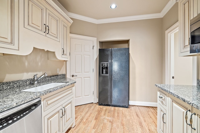 kitchen with sink, ornamental molding, light hardwood / wood-style flooring, stainless steel appliances, and light stone countertops