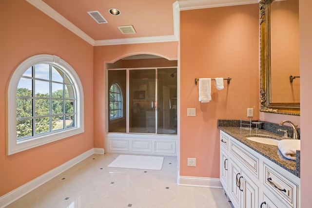 bathroom with tile flooring, vanity, and crown molding