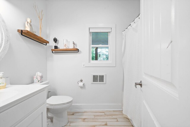 554 Hayes Ridge Rd, Indian Mound, TN 37079 - bathroom featuring vanity, hardwood / wood-style floors, and toilet