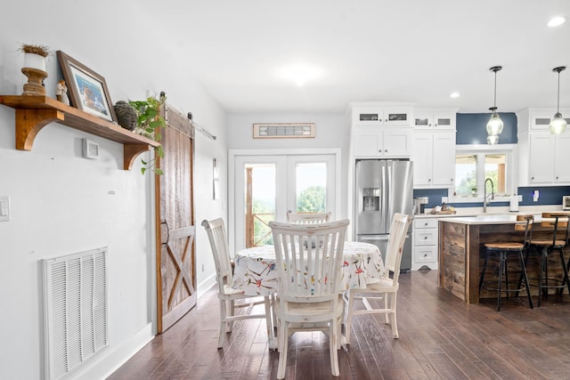 554 Hayes Ridge Rd, Indian Mound, TN 37079 - dining space featuring dark hardwood / wood-style flooring, sink, a barn door, and french doors