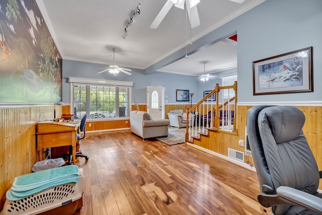 office area with ceiling fan, crown molding, rail lighting, and light hardwood / wood-style floors