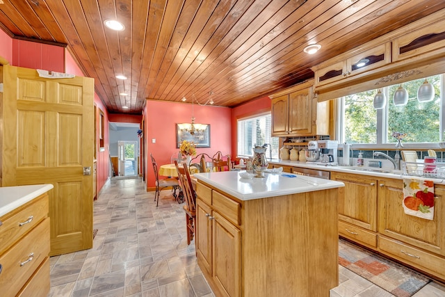 kitchen with a notable chandelier, light tile floors, a center island, wood ceiling, and pendant lighting