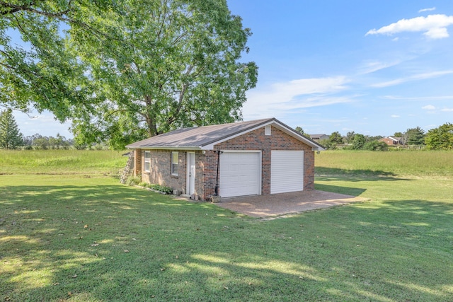 garage featuring a yard