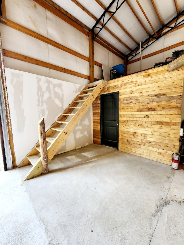 garage featuring wooden walls