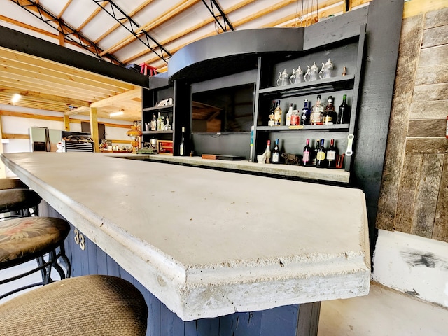 bar featuring concrete floors