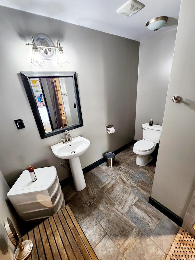 bathroom with tile floors and toilet