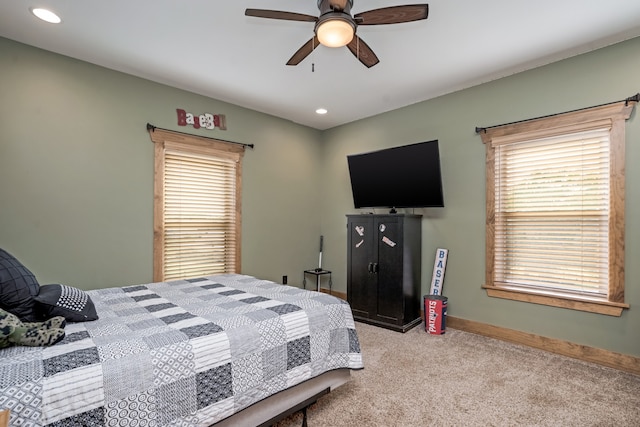 bedroom with light carpet and ceiling fan