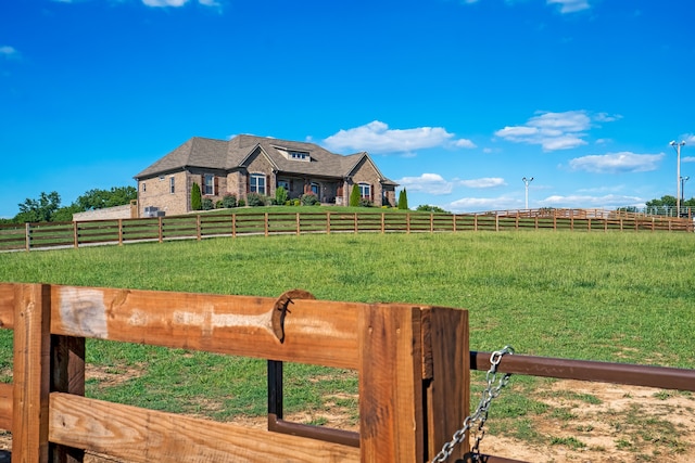 view of yard with a rural view