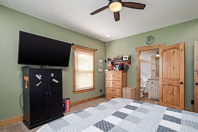 bedroom with ensuite bath and ceiling fan