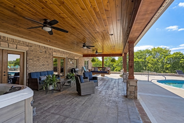 view of patio / terrace with french doors, ceiling fan, and an outdoor hangout area