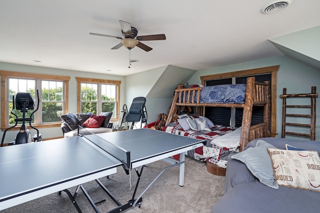 recreation room with vaulted ceiling, carpet floors, and ceiling fan