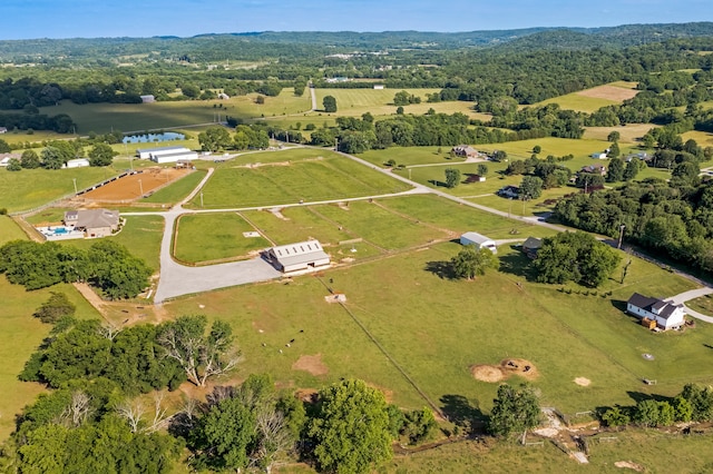 birds eye view of property featuring a water view and a rural view