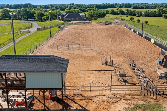 birds eye view of property with a rural view