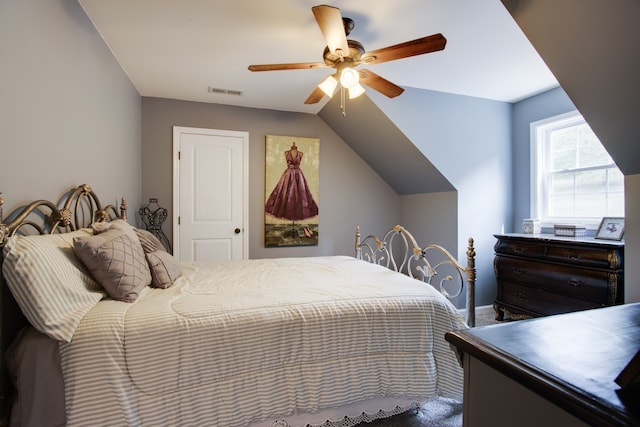 bedroom with lofted ceiling and ceiling fan