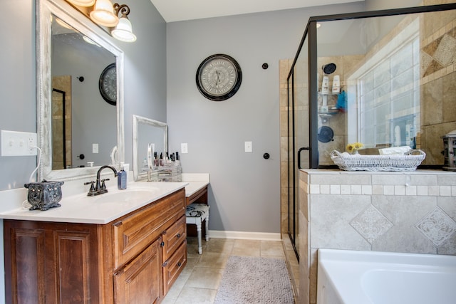 bathroom with tile flooring, vanity with extensive cabinet space, and plus walk in shower