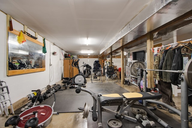 workout room featuring concrete floors