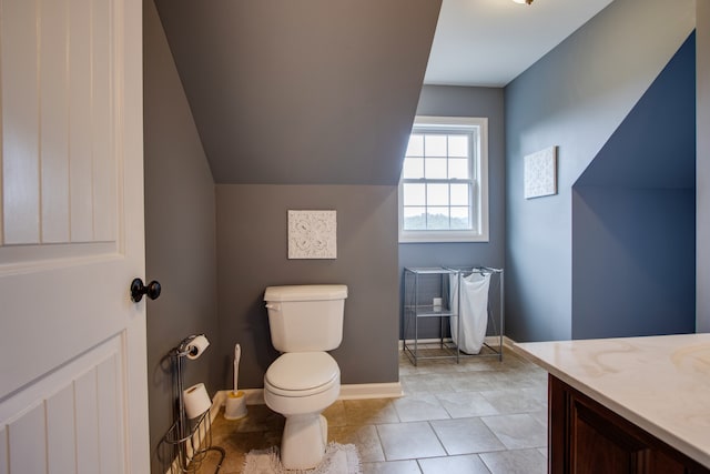 bathroom with vanity, tile flooring, and toilet