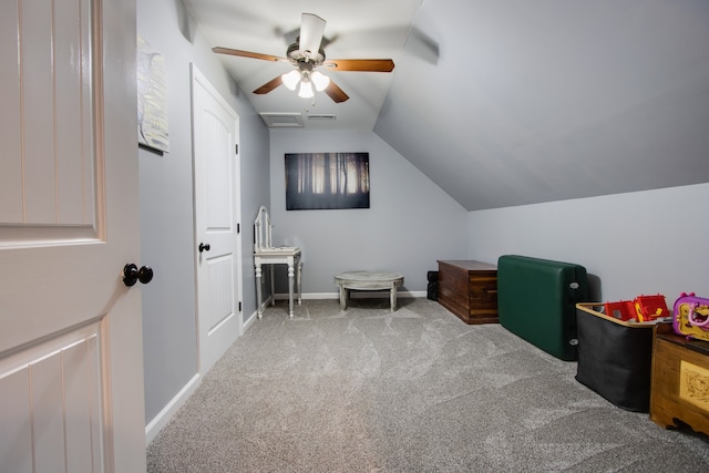 game room featuring ceiling fan, light colored carpet, and vaulted ceiling