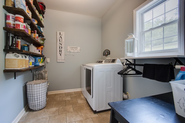 laundry area featuring light tile floors and washer and dryer