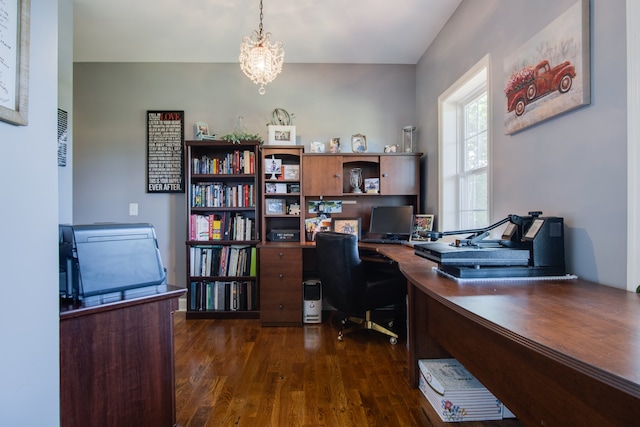 office with an inviting chandelier and dark hardwood / wood-style flooring